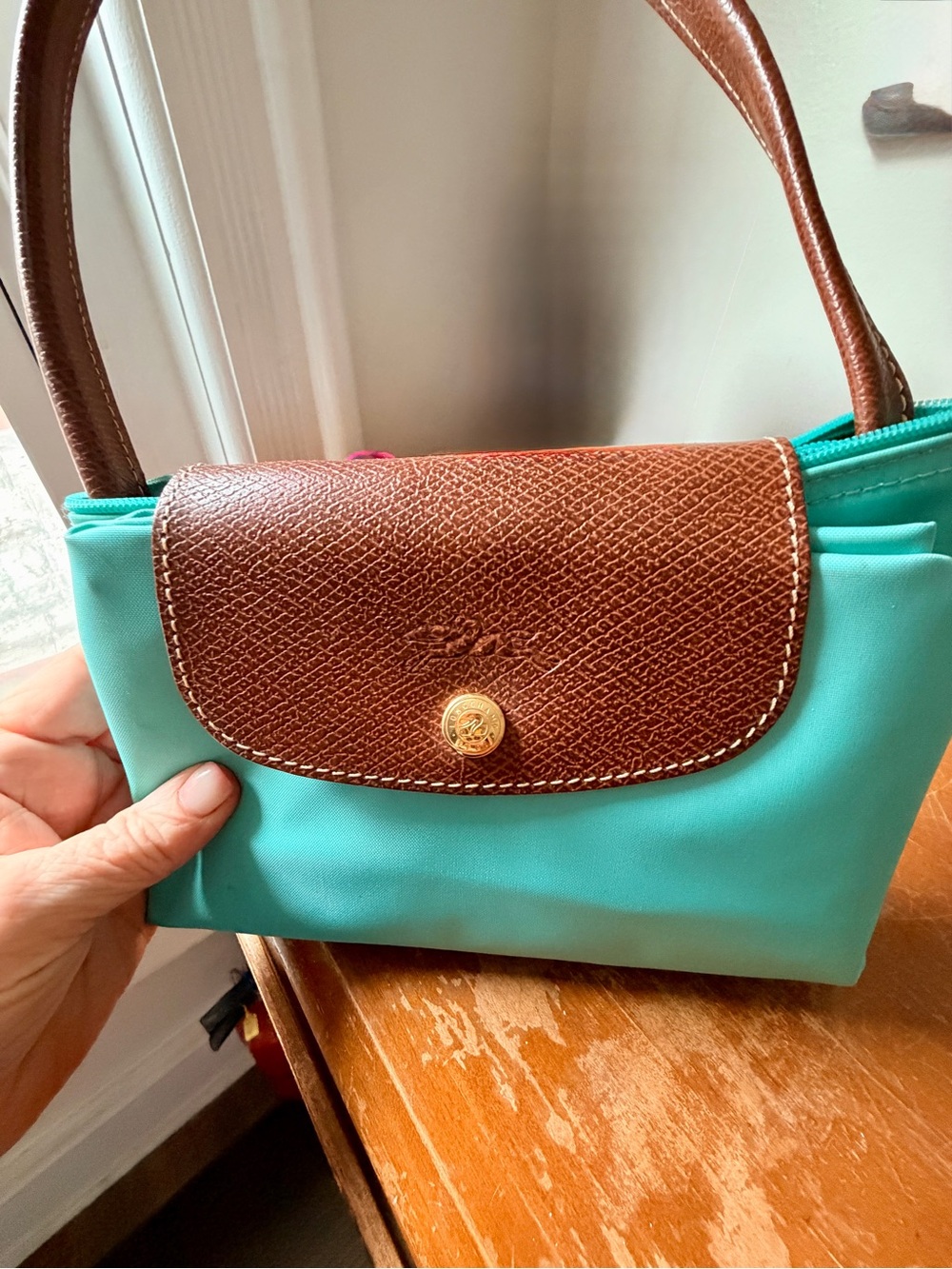 Longchamp Le Pliage large grand shopping tote in turquoise.
